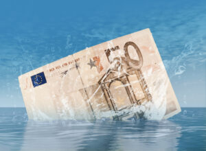 A submerged 50 euro note in clear water, symbolizing economic themes.