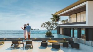 Couple enjoying ocean view from luxury poolside at SKHAI property