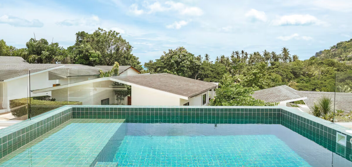 Infinity pool overlooking lush greenery at Sunrise Park Koh Samui