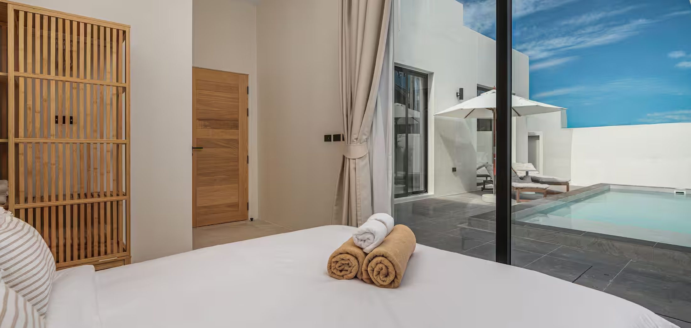 Bedroom opening to private pool at Sunrise Garden Phuket