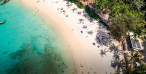 Choeng Mon Beach in Thailand, near SKHAI developments, with turquoise waters and lush nature