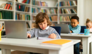 Children studying in a modern classroom setting