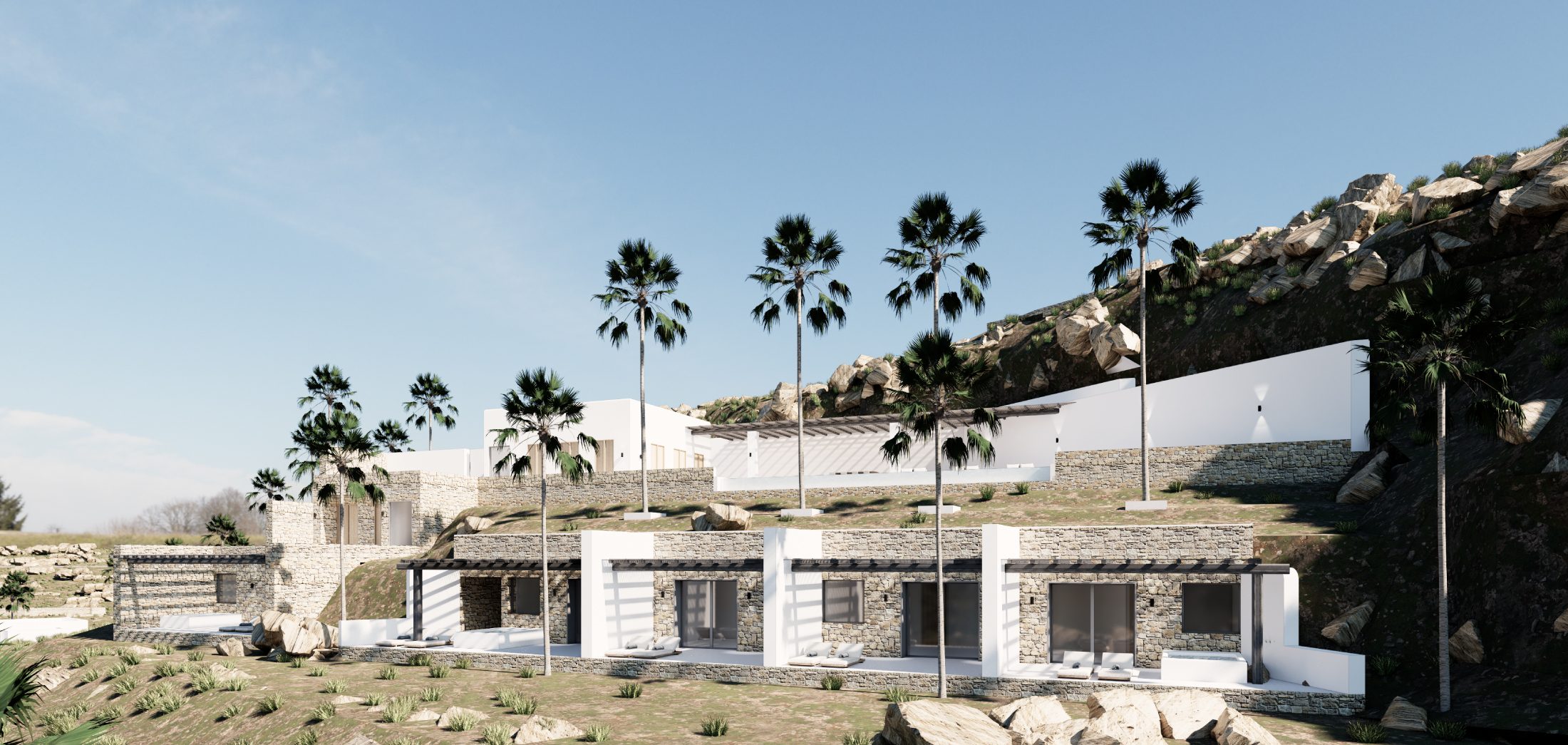 Terraced stone villas with palm trees at Domaine Agapè Mykonos