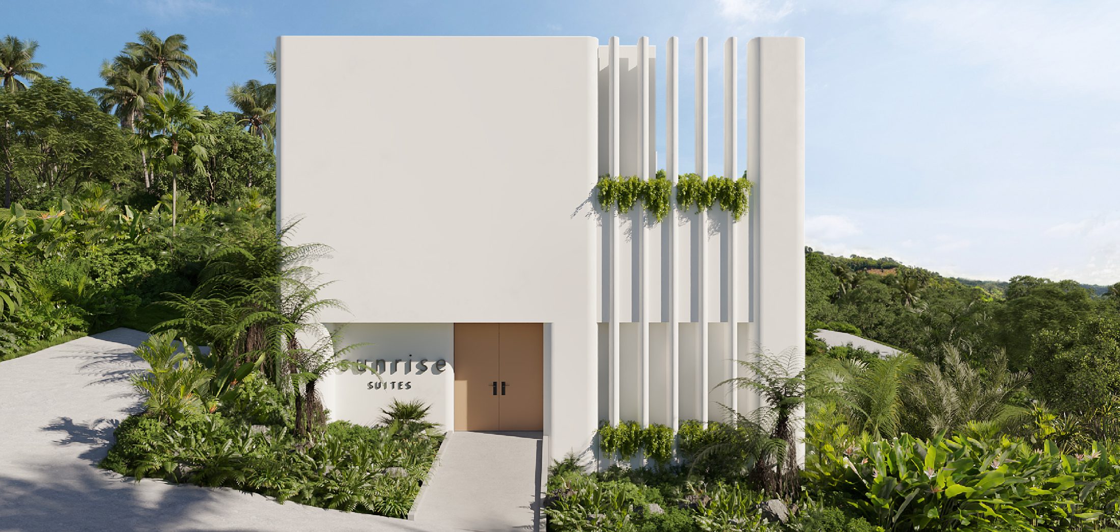 Entrance of Sunrise Suites with lush greenery in Chaweng Noi