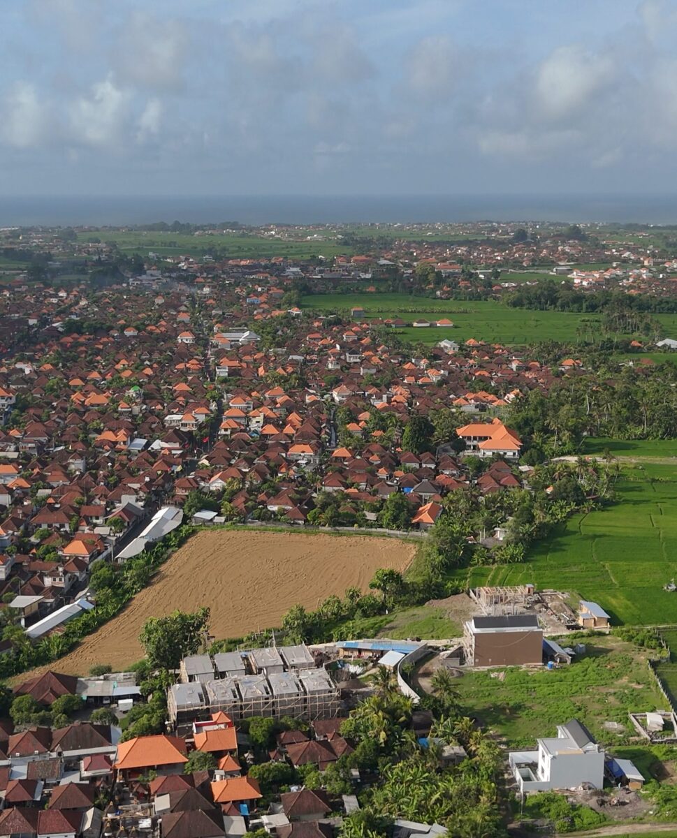 Expansive view of luxury private villas Bali near vibrant local landscape.