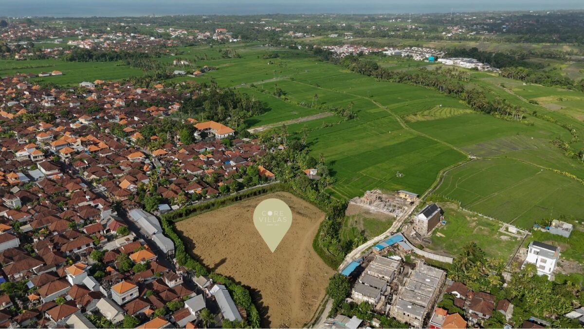 Aerial view of CORE Villas Bali site near lush rice fields